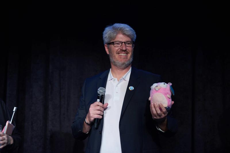 Brian holding a stuffed gopher plushie